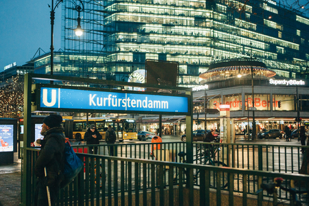 Berlin, December 25, 2017: Entrance to the underpass to the metro station. A sign with the name of the station. City underground subway. Evening or night.のeditorial素材