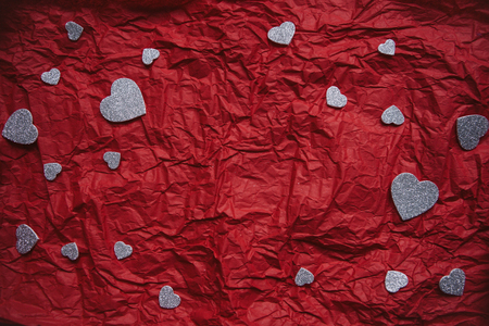 Festive background with many hearts for Valentines Day or another holiday or love event. There is space for text in the middle.の写真素材