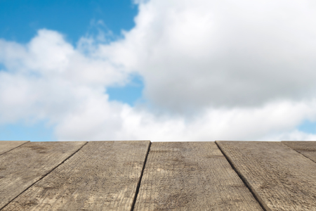 Wooden board or table or surface or floor against the sky - can be used to montage or showcase your productsの写真素材