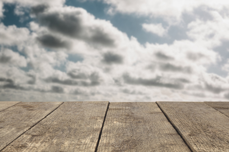 Wooden board or table or surface or floor against the sky - can be used to montage or showcase your productsの写真素材