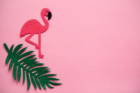 Flamingo on a pink background. Summer minimal design. Near there is a place for text.の写真素材