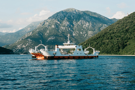 Ferry to transport vehicles and people crosses the bay in Montenegro.の写真素材