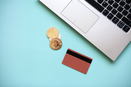 Conceptual photo of e-commerce with credit cards and cryptocurrency. Computer, cryptocurrency and...
