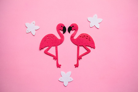 Two red flamingos on a pink background in minimal style.の写真素材