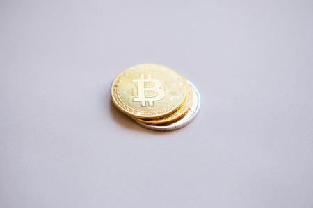 Set of coins bitcoin and other cryptocurrency on a white background. Bitcoin is higher than other coins. Modern electronic payment instrument.の写真素材
