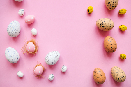 Set of colored eggs on a pink background. Festive Easter concept.の写真素材