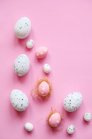 Set of colored eggs on a pink background. Festive Easter concept.の写真素材