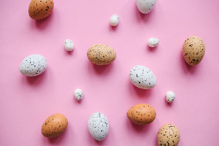 Set of colored eggs on a pink background. Festive Easter concept.の写真素材