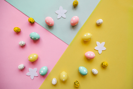 Set of colored eggs on a colorful background. Festive Easter background. In the middle there is a place for text.の写真素材