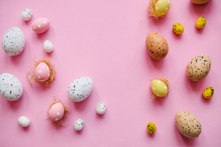 Set of colored eggs on a pink background. Festive Easter concept.の写真素材