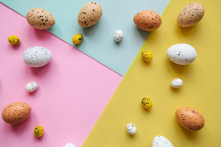 Set of colored eggs on a colorful background. Festive Easter background. In the middle there is a place for text.の写真素材