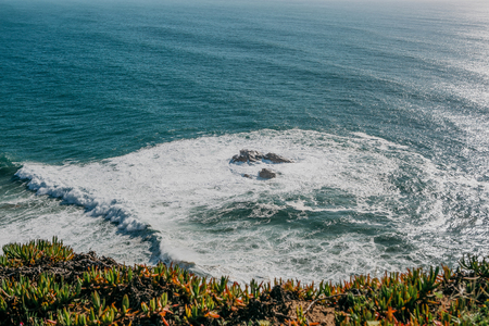 Beautiful view of the Atlantic Ocean from the western point on Cape Roca in Portugal.の写真素材
