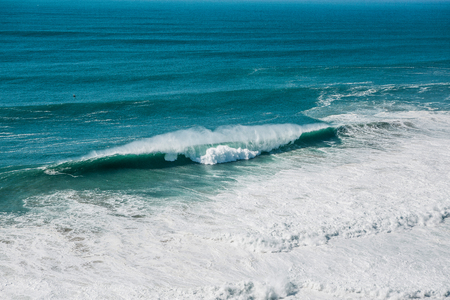 Wave and foam in the sea or ocean close-up. Beautiful nature.の写真素材