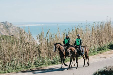 Portugal, Sintra, May 01, 2018: Mounted police patrol the area and protect public orderのeditorial素材