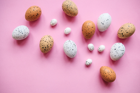 Set of colored eggs on a pink background. Festive Easter concept.の写真素材