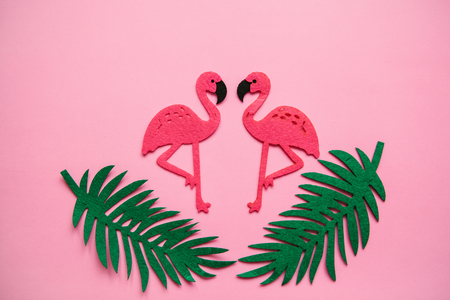 Flamingos and leaves on a pink background. Summer design.の写真素材