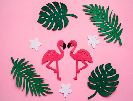 Flamingos and leaves on a pink background. Summer design.の写真素材