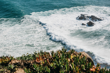 Beautiful view of the Atlantic Ocean from the western point on Cape Roca in Portugal.の写真素材