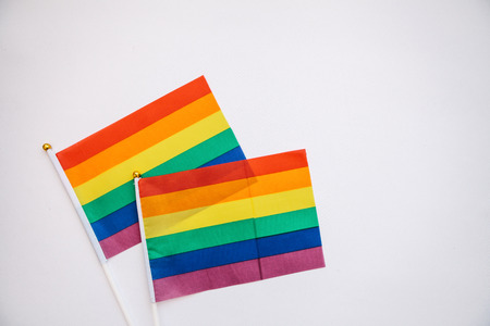 Multicolored flags of the color of the rainbow or LGBT flags on a white background.の写真素材