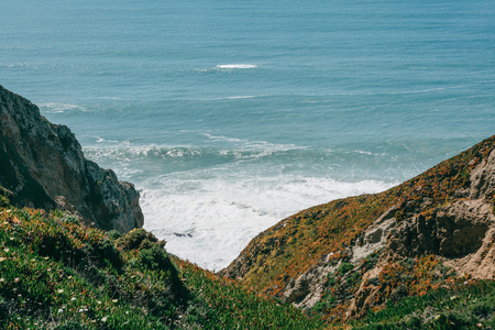 Beautiful view of the Atlantic Ocean from the western point on Cape Roca in Portugal.の写真素材