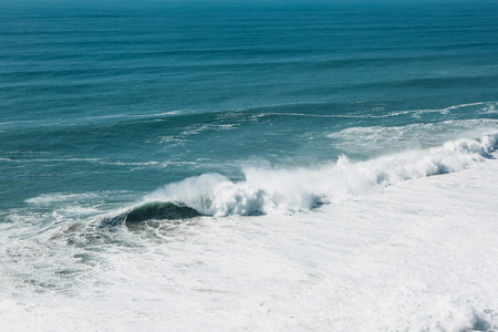 Wave and foam in the sea or ocean close-up. Beautiful nature.の写真素材