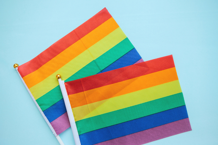 Multicolored flags of the color of the rainbow or LGBT flags on a blue background.の写真素材