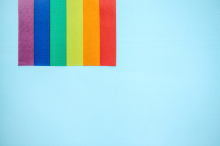 Multicolored flag of the color of the rainbow or LGBT flag on a blue background.