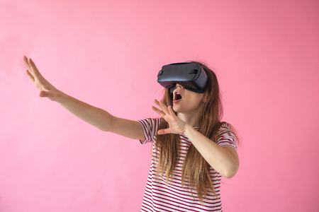 The woman with glasses of virtual reality. Future technology concept. Modern imaging technology.の写真素材