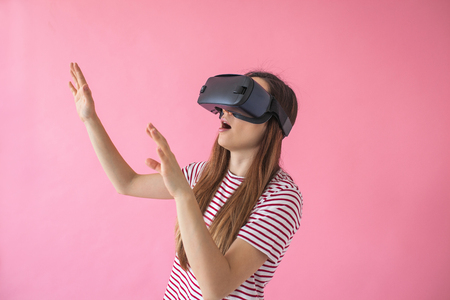 The woman with glasses of virtual reality. Future technology concept. Modern imaging technology.の写真素材