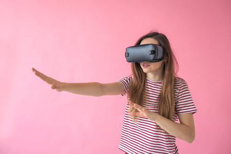 The woman with glasses of virtual reality. Future technology concept. Modern imaging technology.の写真素材