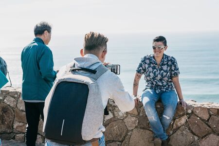 Portugal, Sintra, June 26, 2018: People or tourists relax and take memory photos on Cape Roca on a sunny summer day.のeditorial素材