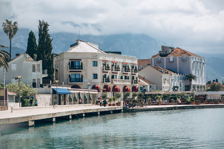 Beautiful view of the architecture of the coastal city of Tivat in Montenegro against the backdrop of the sea and mountains.の写真素材