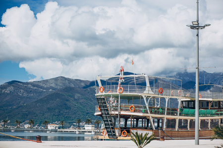 Beautiful view of the mountains and the ship off the coast of Tivat in Montenegro.の写真素材