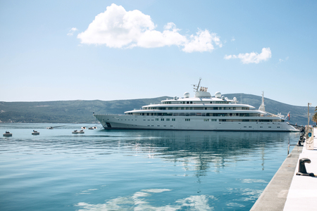 The ship or yacht is moored at the shore and awaits navigation. Summer sea vacation or cruise.の写真素材