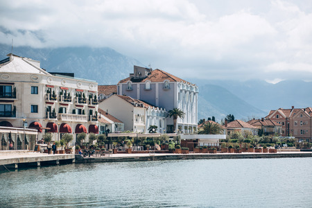 Beautiful view of the architecture of the coastal city of Tivat in Montenegro against the backdrop of the sea and mountains.の写真素材