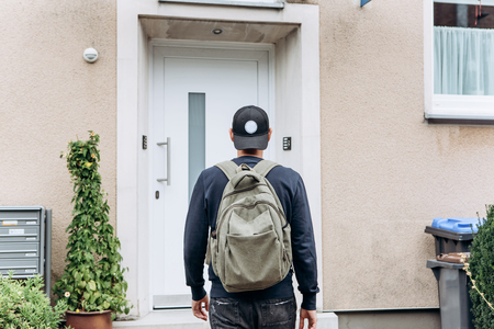 A tourist goes to the guesthouse or hostel in order to stay in a room that he booked.の写真素材