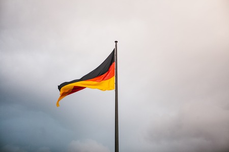 German national flag in the wind against the skyの写真素材