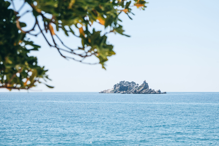View of beautiful islets Katic and Sveta Nedjelja with orthodox church near Petrovac in Montenegro in the municipality of Budva.の写真素材