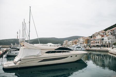 Beautiful view of the yachts in the port and urban architecture in Lustica Bay in Montenegro.の写真素材
