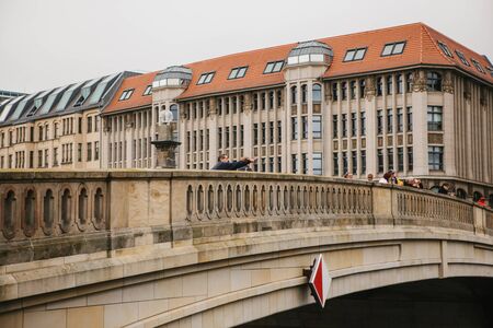 Germany, Berlin, October 24, 2018: Bridge over the River Spree. People admire the beautiful view of the city.のeditorial素材