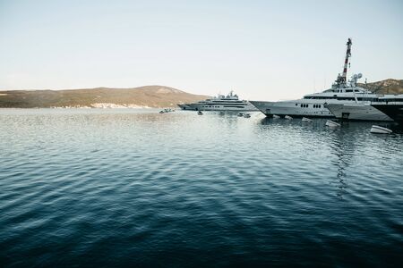 Beautiful view of yachts in the port of Montenegro. Natural landscape in the background.の写真素材