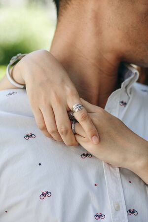 Closeup of a woman hugging a man. Close relationship or flirt or love.