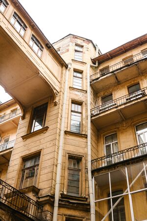 Traditional old apartment building with windows in St. Petersburg in Russia.の写真素材