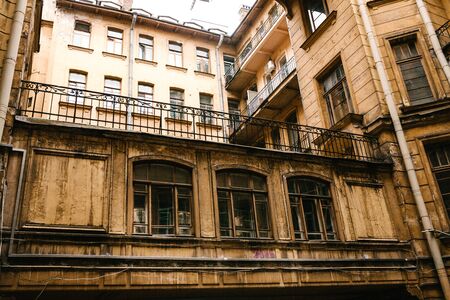 Traditional old apartment building with windows in St. Petersburg in Russia.の写真素材