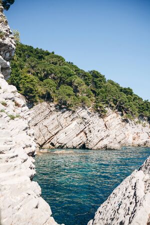 Beautiful view of the natural landscape with the sea and cliffs in Montenegro near Petrovac.の写真素材