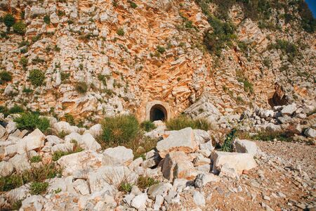 View of the mountain or stone rock in which there is a tunnel for passage.の写真素材
