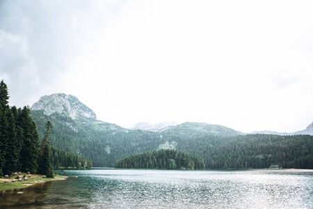 Beautiful view of the lake - Black Lake, forest and mountain landscape in Montenegro.の写真素材