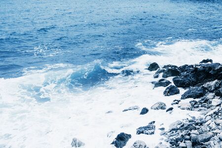 Restless sea near the stone coast. Natural landscapeの写真素材