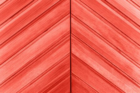Wooden surface or close-up closed door in trendy living coral colorの写真素材