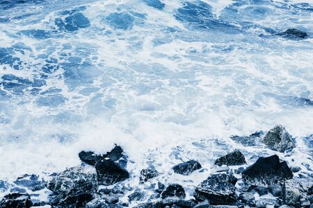 Restless sea near the stone coast. Natural landscapeの写真素材